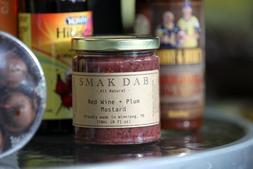 Carla Dayholos makes made-in-Manitoba gift baskets filled with all locally made products through her  company called Mulberry Tree that ships baskets of Manitoba goodies all over the world.  Smak Dab mustard.  Dave Sanderson story.   Nov 29,  2014 Ruth Bonneville / Winnipeg Free Press