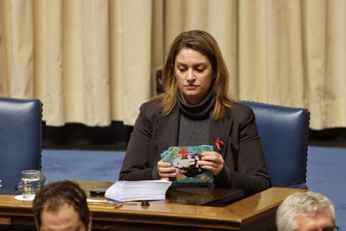 NDP MLA Erin Selby (Southdale) signs Christmas cards while the the assembly is in session Monday afternoon.  141201 December 01, 2014 Mike Deal / Winnipeg Free Press