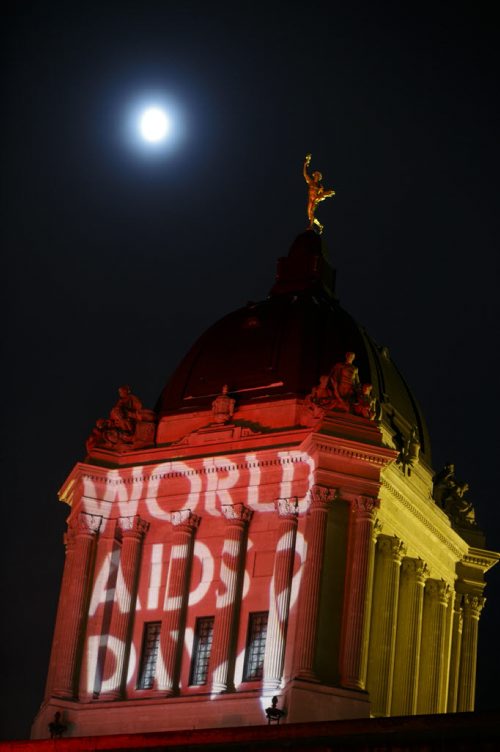 The Manitoba Legislative Building is illuminated in red and a projection commemorating World AIDS Day. Held annually on December 1, World AIDS Day is dedicated to commemorate those who have died of the disease, and to raise awareness about AIDS and the global spread of the HIV virus. The Canadian government said in 2013, 1.5 million people died of AIDS-related causesÄîdown by 35 percent from the peak in 2005. 141201 - Monday, December 01, 2014 - (Melissa Tait / Winnipeg Free Press)