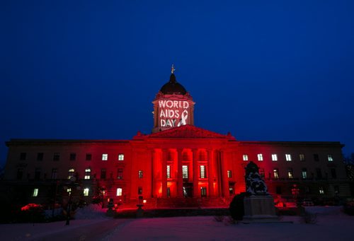 The Manitoba Legislative Building is illuminated in red and a projection commemorating World AIDS Day. Held annually on December 1, World AIDS Day is dedicated to commemorate those who have died of the disease, and to raise awareness about AIDS and the global spread of the HIV virus. The Canadian government said in 2013, 1.5 million people died of AIDS-related causesÄîdown by 35 percent from the peak in 2005. 141201 - Monday, December 01, 2014 - (Melissa Tait / Winnipeg Free Press)