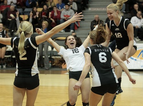 December 1, 2014 - 141201  -  Lord Selkirk Royals Lauren Weremy (2), Logan Desorcy (16), Karly Smith (6) and Ashley Grzebeniak (18) celebrate a win over the MBCI Hawks in the Manitoba High Schools Athletic Associations AAAA Girls Volleyball final at University of Manitoba Monday, December 1, 2014.  John Woods / Winnipeg Free Press