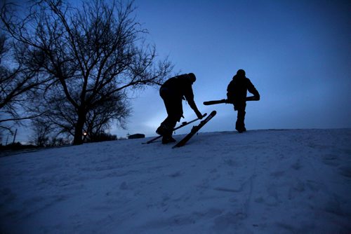 High school students Will Purves (left)  and  Rheis Penner (right, helmet), take advantage of the warmer weather and remaining later afternoon light to ski down the hill at Omands Creek Tuesday afternoon. Standup photo.   Dec 02,  2014 Ruth Bonneville / Winnipeg Free Press