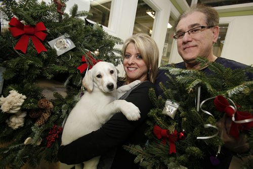 December 2, 2014 - 141202  -  On Tuesday, December 2, 2014 Lianne Tregobov, owner Camelot Introductions, and D'arcy Johnston founder and CEO of D'arcy's Arc are selling wreaths as a fundraiser for the shelter.  John Woods / Winnipeg Free Press