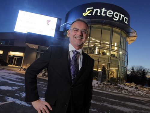 BIZ - Entegra Credit Union, which has been operating exclusively in the north part of Winnipeg for the past half century, has opened its first south Winnipeg location in St. Vital to service its growing number of south end customers. Gordon Kirkwood, CEO of Entegra Credit Union poses for a photo in front of the new building. BORIS MINKEVICH / WINNIPEG FREE PRESS December 3, 2014