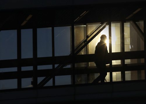 A passerby crosses over Smith St in a walkway over Smith St in Winnipeg Thursday morning- Standup photo  Dec 04, 2014   (JOE BRYKSA / WINNIPEG FREE PRESS)
