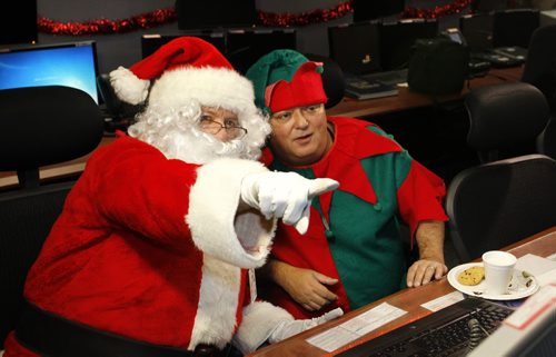Santa Claus along with his Elf Eugene attended his annual pre-flight operational briefing Thursday at the Canadian NORAD Region HQ to guarantee a safe sleigh and reindeer fight later this month. Canadian NORAD Region staff are in their final preparations for the 2014 NORAD Tracks Santa Operation. Wayne Glowacki / Winnipeg Free Press Dec.4  2014