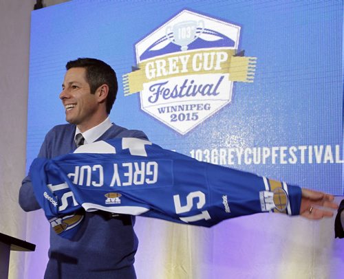 Mayor Brian Bowman was presented with a Bomber jersey in Winnipeg Square Friday at the unveiling of the 103rd Grey Cup brand. In addition, the 103rd Grey Cup headquarters and store in Winnipeg Square was officially opened.  Wayne Glowacki / Winnipeg Free Press Dec.5 2014