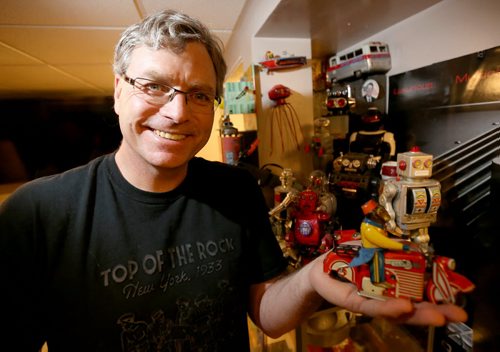 Steve Chmara collects vintage tin toys (wind-up and battery-operated) from the '40s and '50s, Thursday, December 4, 2014. (TREVOR HAGAN/WINNIPEG FREE PRESS)