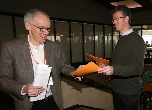 Steve Ashton accepts a statement from the 6 rebel NDP MLAs from Andrew Swan at todays provincial council meeting, Saturday, December 6, 2014. (TREVOR HAGAN/WINNIPEG FREE PRESS)