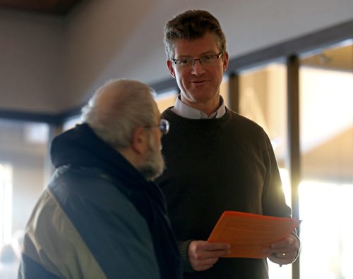 Andrew Swan hands out a statement from the 6 rebel NDP MLAs at todays provincial council meeting, Saturday, December 6, 2014. (TREVOR HAGAN/WINNIPEG FREE PRESS)