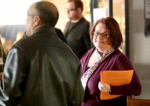 Jennifer Howard hands out a statement from the 6 rebel NDP MLAs at todays provincial council meeting, Saturday, December 6, 2014. (TREVOR HAGAN/WINNIPEG FREE PRESS)