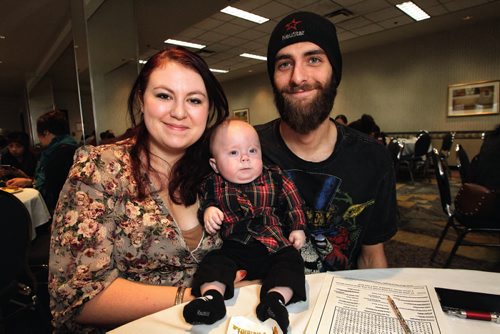 Samantha Hilder (left) with her husband Steven Titarniuk (right) and their little guy, six-month-old, Oliver, who has two holes in his heart and needs repairs to his aorta and a valve, during a Christmas breakfast for kids and their families who have been through heart surgery at the Clarion Hotel Sunday morning.  141207 December 07, 2014 Mike Deal / Winnipeg Free Press