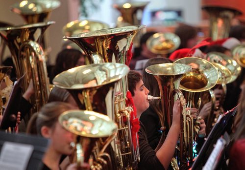 Aidan Labossiere, 13, performs with almost 100 other tuba and euphonium musicians during the MBA's Christmas Tuba Festival which was established in 2002 and provides an opportunity for players from across Manitoba to gather and perform a concert of Christmas carols in the Manitoba Centennial Concert Hall for Winnipeg Symphony Orchestra patrons. 141207 December 07, 2014 Mike Deal / Winnipeg Free Press