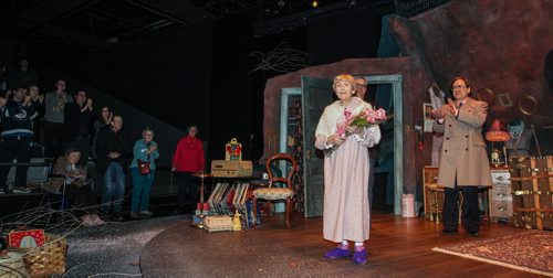 Doreen Brownstone, the 92-year-old actress gives her final main stage bow Sunday, at the closing performance of Vigil by Morris Panych at Prairie Theatre Exchange. Actor Michael Spencer-Davis (right) watches as PTE artistic director Robert Metcalfe (behind Doreen) presented Doreen with some flowers as she finishes over five decades of performing on Winnipeg stages.  141207 - Sunday, December 07, 2014 -  (MIKE DEAL / WINNIPEG FREE PRESS)