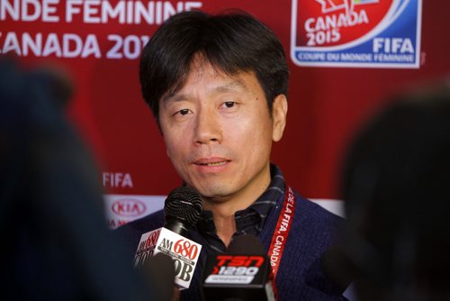 SPORTS -  FIFA WOMENS WORLD CUP CANADA 2015 OFFICIAL DRAW VIEWING PARTY AND GROUP D TEAM SITE VISIT. Team China PR: team administrator Feiyu Li at a press conference. BORIS MINKEVICH / WINNIPEG FREE PRESS December 8, 2014