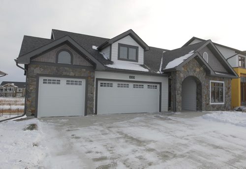 NEW HOMES - 112 Lake Bend Road in Bridgwater Lakes. Hearth Homes Liam Milne rep was there. BORIS MINKEVICH / WINNIPEG FREE PRESS December 8, 2014