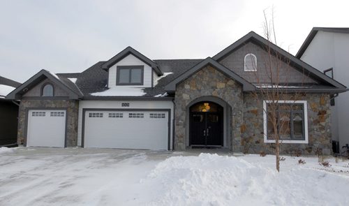 NEW HOMES - 112 Lake Bend Road in Bridgwater Lakes. Hearth Homes Liam Milne rep was there. BORIS MINKEVICH / WINNIPEG FREE PRESS December 8, 2014