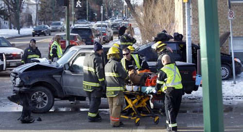 At least one person was sent to the hospital after two vehicles collided on Corydon Ave. at Harrow St. Tuesday morning. A tow-truck was needed to pull away a vehicle that was up against the wall of the Lady Harrow Apts.  so Fire Paramedics could check out the occupant.   Wayne Glowacki / Winnipeg Free Press Dec.9 2014
