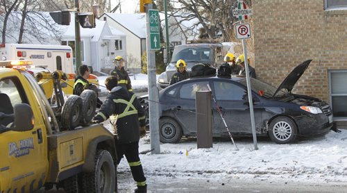 At least one person was sent to the hospital after two vehicles collided on Corydon Ave. at Harrow St. Tuesday morning. A tow-truck was needed to pull away a vehicle that was up against the wall of the  Lady Harrow Apts.  so Fire Paramedics could check out the occupant.   Wayne Glowacki / Winnipeg Free Press Dec.9 2014