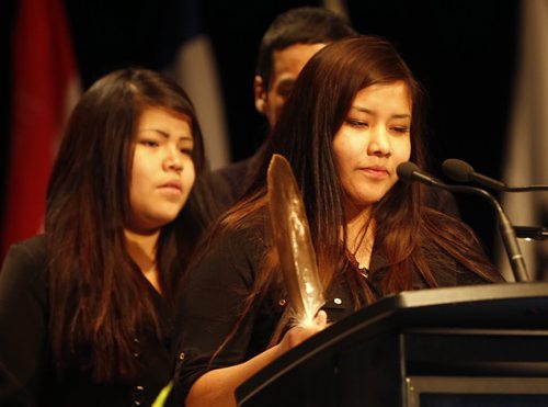 Rinelle Harper being honoured at AFN with an eagle feather , left is her sister Rayne  at AFN Special Chiefs Assembly held at RBC Winnipeg Convention Dec. 9 2014 / KEN GIGLIOTTI / WINNIPEG FREE PRESS