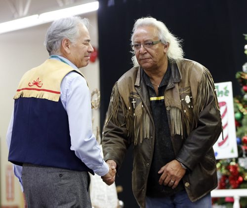 Stdup AFN .The Assembly of First Nations National Election candidates left Chief  Ghislain Picard AFN and right Chief Leon Jourdain national candidate shake hands at an early morning breakfast  and at the Indian Metis Friendship Centre  fund raiser.Dec. 9 2014 / KEN GIGLIOTTI / WINNIPEG FREE PRESS