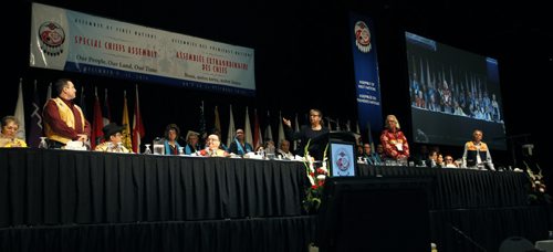 In centre,  Loretta Lambert, AFN Chief Electoral Officer introduces candidates from left standing Perry Bellegarde, Leon Jourdain and Ghislain Picard at the All Candidates Forum for National Chief held Tuesday in the RBC Convention Centre Winnipeg. Mary Agnes Welch story. Wayne Glowacki / Winnipeg Free Press Dec.9 2014