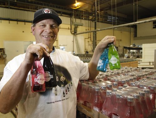 Peter De Jong, pres. of Canadian Gold Beverages Inc. in Marchand Mb. with his Pic-a-pop  selection. Pic-a-pop has been bought and revived by Canadian Gold Beverages. The 1970s pops haven't been available since the Angostura plant shut down five years ago.Geoff Kirbyson story Wayne Glowacki / Winnipeg Free Press Dec.11 2014