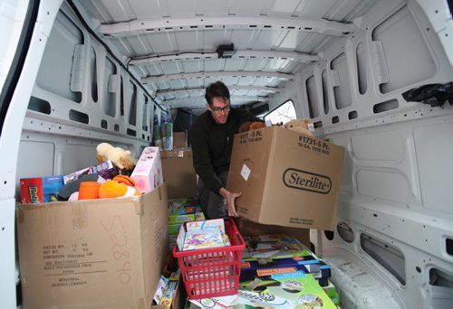Employee's of The Bargain Shop on Main street collected boxes full of toys for Siloam Mission through a toy drive even though they will all be losing their jobs in the coming weeks due to the store closing.  Tim Cruickshank with Siloam Mission packs boxes full of toys into their van that were collected through a toy drive. See Story.  Dec 11,  2014 Ruth Bonneville / Winnipeg Free Press