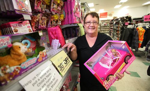 Sylvia Maksymchuk who has been an employee at The Bargain Shop on Main street for 22 years helped collect boxes full of toys for Siloam Mission through a toy drive even though she will be losing her job in the coming weeks due to the store closing.   See Story.  Dec 11,  2014 Ruth Bonneville / Winnipeg Free Press
