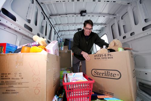 Employee's of The Bargain Shop on Main street collected boxes full of toys for Siloam Mission through a toy drive even though they will all be losing their jobs in the coming weeks due to the store closing.  Tim Cruickshank with Siloam Mission packs boxes full of toys into their van that were collected through a toy drive. See Story.  Dec 11,  2014 Ruth Bonneville / Winnipeg Free Press