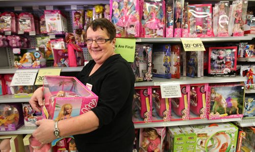Sylvia Maksymchuk, an employee at The Bargain Shop on Main street for 22 years, is ecstatic at the amount of toys that came in from a toy drive the employees had by placing signs up on the store shelves asking people to donate for toys Siloam Mission.  The employee's will all be losing their jobs in a few weeks due to the store closing.   See Story.  Dec 11,  2014 Ruth Bonneville / Winnipeg Free Press