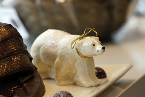 white chocolate polar bear  . Sunday This City - Chocolatier Constance Popp .** note last name is different from company name.  Chocolatier Constance Popp, 180 Provencher Blvd. -  owner Constance Menzies  for a Sunday This City spread on Menzies's St Boniface chocolate shop - a spot that has made a name for itself during the last 7 years, for its treats and creative designs, when it comes to chocolate. Christmas goodies available - chocolate in all shapes of trees, nutcrackers, etc - as well as a shot of Menzie's Human Rights Museum made out of chocolate - a creation that blew the museum's architect away, when Menzies presented him with one a few months Dec. 11 2014 / KEN GIGLIOTTI / WINNIPEG FREE PRESS
