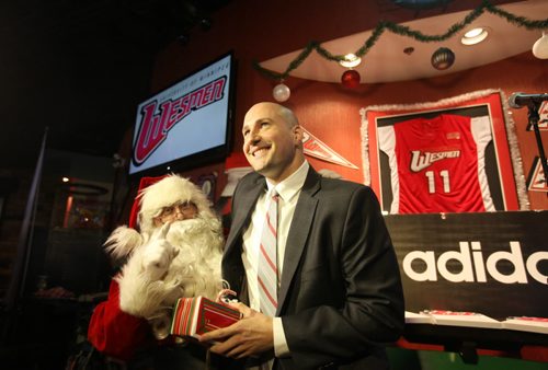 Wesman men's basketball coach Mike Raimbault gets a surprise visit and gift from Santa at the Launch of The 48th Annual  WESMEN CLASSIC that took place Thursday at the U of W Anx.    Dec 11,  2014 Ruth Bonneville / Winnipeg Free Press