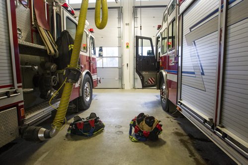 Gear at the read by the fire trucks during a tour of the new Winnipeg Fire Paramedic Service Station 11 at Portage Avenue and Route 90. 141211 - Thursday, December 11, 2014 -  (MIKE DEAL / WINNIPEG FREE PRESS)