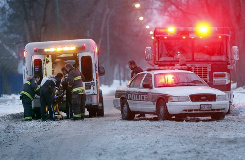 Breaking New . Wpg Police , fire and paramedics were called to house on Manitoba Ave at McGregor St. one person was transported to hospital with apparently a stab wound .Police are searching the area . Dec. 12 2014 / KEN GIGLIOTTI / WINNIPEG FREE PRESS