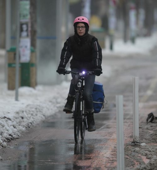 LOCAL - STANDUP - A cyclist speeds down Sherbrook Street in the mild Friday morning temperatures. NO NAME OF CYCLIST. BORIS MINKEVICH / WINNIPEG FREE PRESS December 12, 2014