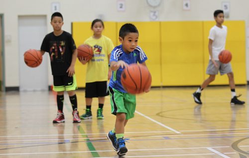 49.8 feature on the Philippine Basketball League of Winnipeg.  Lenin Mangaron, former college star now coaches young team at Sargent Park School.   Five year old Kandon Mangaron practices with team.   Dec 13/14 Ruth Bonneville / Winnipeg Free Press