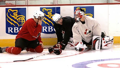 BORIS MINKEVICH / WINNIPEG FREE PRESS  070903 Dana Tyrell, Luke Schenn, and goalie Steve Mason have a few laughs after Schenn tripped over them in Team Canada's practice.