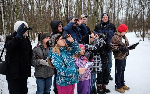 CHRISTMAS BIRD COUNT - Birders and interested naturalists gathered at FortWhyte Alive Sunday afternoon to become citizen scientists and count the birds. The information gathered helps researchers learn more about birds and how to protect them. A group stops to check out a few woodpeckers along the trails at FortWhyte Alive. 141214 - Sunday, December 14, 2014 -  (MIKE DEAL / WINNIPEG FREE PRESS)