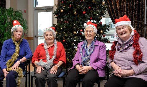 Rockin' Grannies gather by the Christmas tree at The Parkway senior residence. They are participating in the choir contest for Miracle on Mountain. (left-right) Elizabeth Watkins, Patricia Kettner, Elsie Alguire and Norma Mulcair. 141214 - Sunday, December 14, 2014 -  (MIKE DEAL / WINNIPEG FREE PRESS)