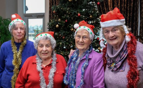 Rockin' Grannies gather by the Christmas tree at The Parkway senior residence. They are participating in the choir contest for Miracle on Mountain. (left-right) Elizabeth Watkins, Patricia Kettner, Elsie Alguire and Norma Mulcair. 141214 - Sunday, December 14, 2014 -  (MIKE DEAL / WINNIPEG FREE PRESS)