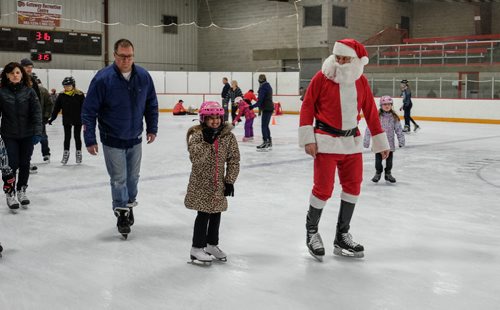 SKATE WITH SANTA - Kids and adults had the chance to strap on the blades and hit the ice with the Jolly Old Elf at Gateway Recreation CentreÄôs Skate with Santa on Sunday. Jazzlyn Hanna, 9, did a few laps with Santa. 141214 - Sunday, December 14, 2014 -  (MIKE DEAL / WINNIPEG FREE PRESS)