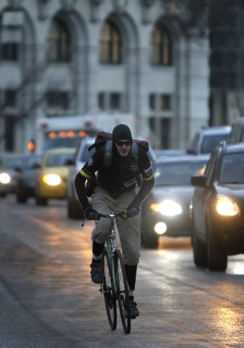 49.8 In Conversation. Bike courier Matt Magura. Stephen Burns story Wayne Glowacki / Winnipeg Free Press Dec.16 2014