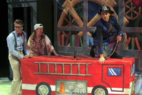 ENT-Munsch Upon a Time directed by Sharon Bajer. Darrin Martins plays the Professor, Andrea Houssin plays Patsy(hippy in photo), and Aaron Hutton plays Fullerton (fireman). The Prairie Theatre Exchange show runs into the new year. BORIS MINKEVICH / WINNIPEG FREE PRESS  December 16, 2014
