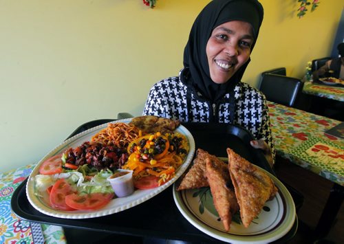 ENT- Restaurant review - Palm Tree on Ellice. Chef Samira Abdi cooked up Sambucas and Kalaankal dry beef stew platter dish.  BORIS MINKEVICH / WINNIPEG FREE PRESS  December 16, 2014