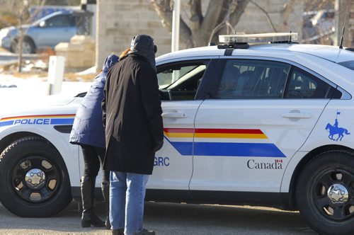 LOCAL - Caspian at 2245 McGillivray Blvd with RCMP in front. Media talk to cops. BORIS MINKEVICH / WINNIPEG FREE PRESS  December 17, 2014