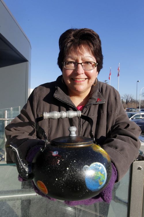 Donna Harris, president of the Humanists, Atheists and Agnostics of Manitoba, with the group's version of "Russell's Teapot." BORIS MINKEVICH / WINNIPEG FREE PRESS  December 17, 2014