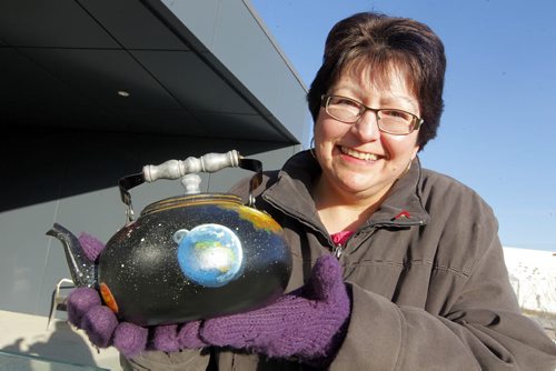 Donna Harris, president of the Humanists, Atheists and Agnostics of Manitoba, with the group's version of "Russell's Teapot." BORIS MINKEVICH / WINNIPEG FREE PRESS  December 17, 2014