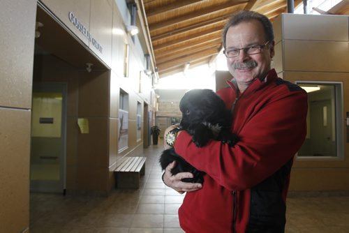 Winnipeg Humane Society CEO Bill McDonald is leaving in January to take a position with a US-based foundation that funds animal shelters, spay and neuter clinics, etc. across North America. He is holding a puppy named Holly at the Winnipeg Humane Society. Wayne Glowacki / Winnipeg Free Press Dec.18 2014
