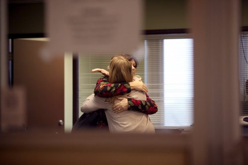 Theresa Oswald gets a hug from a longtime co-worker and assistant Breigh Kusmack just before leaving the NDP office after officially signing the paperwork to enter the Manitoba NDP's leadership race Friday.   Dec 19/14 Ruth Bonneville / Winnipeg Free Press